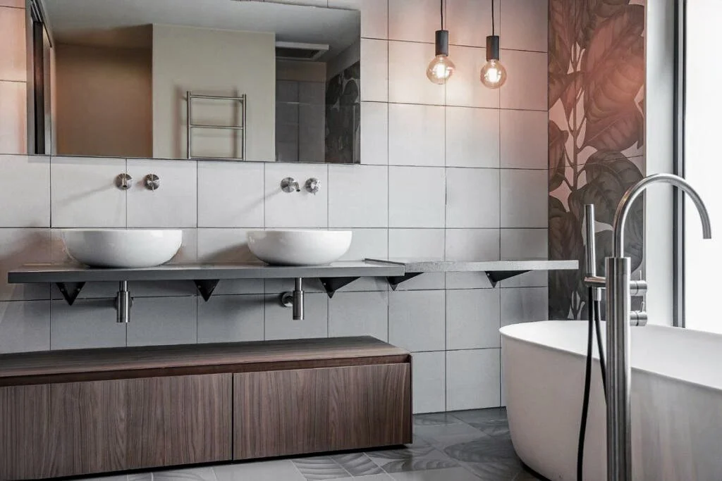 Contemporary primary en-suite bathroom featuring high-specification fittings, premium sanitaryware, and refined finishes in a new-build residence in Walton-on-Thames.