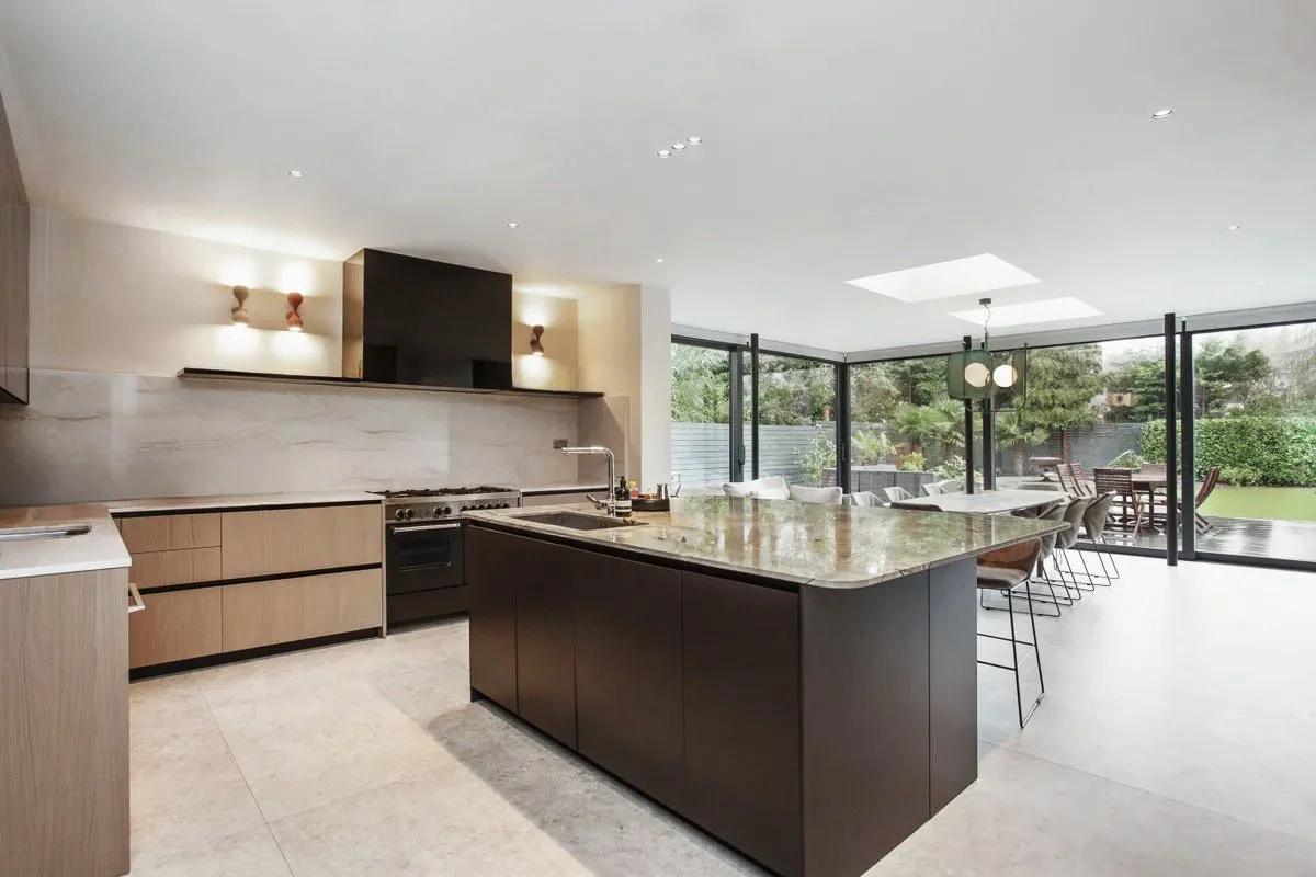 Bespoke contemporary kitchen design with island and dining area in a new-build Surrey home.
