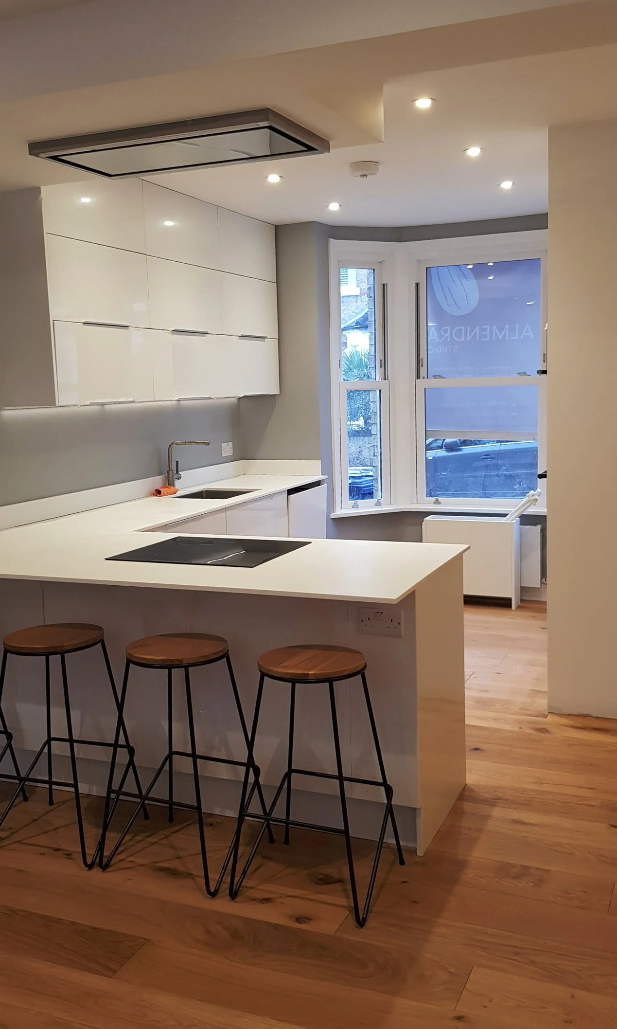Open-plan kitchen and dining area with integrated island in Ealing