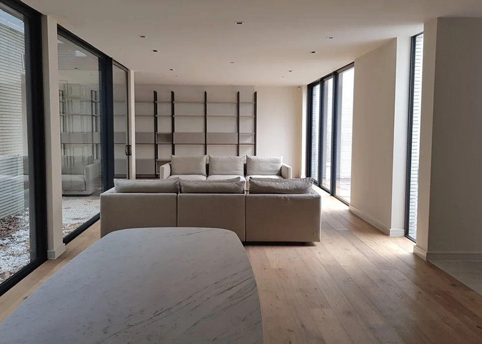 Residential interior architecture featuring a lightwell for daylight and sunlight illumination delivered by Almendra Studio London  - Design & Build.