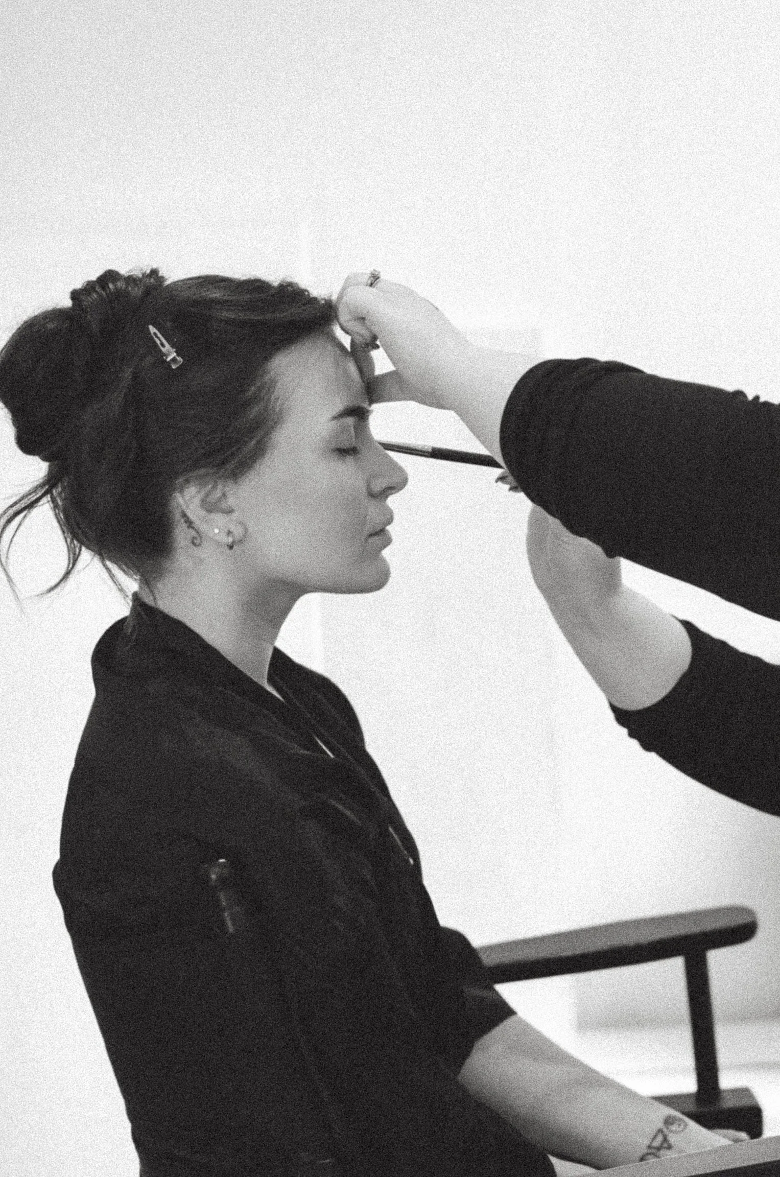 Bride getting ready as professional bridal makeup is carefully applied before the ceremony.