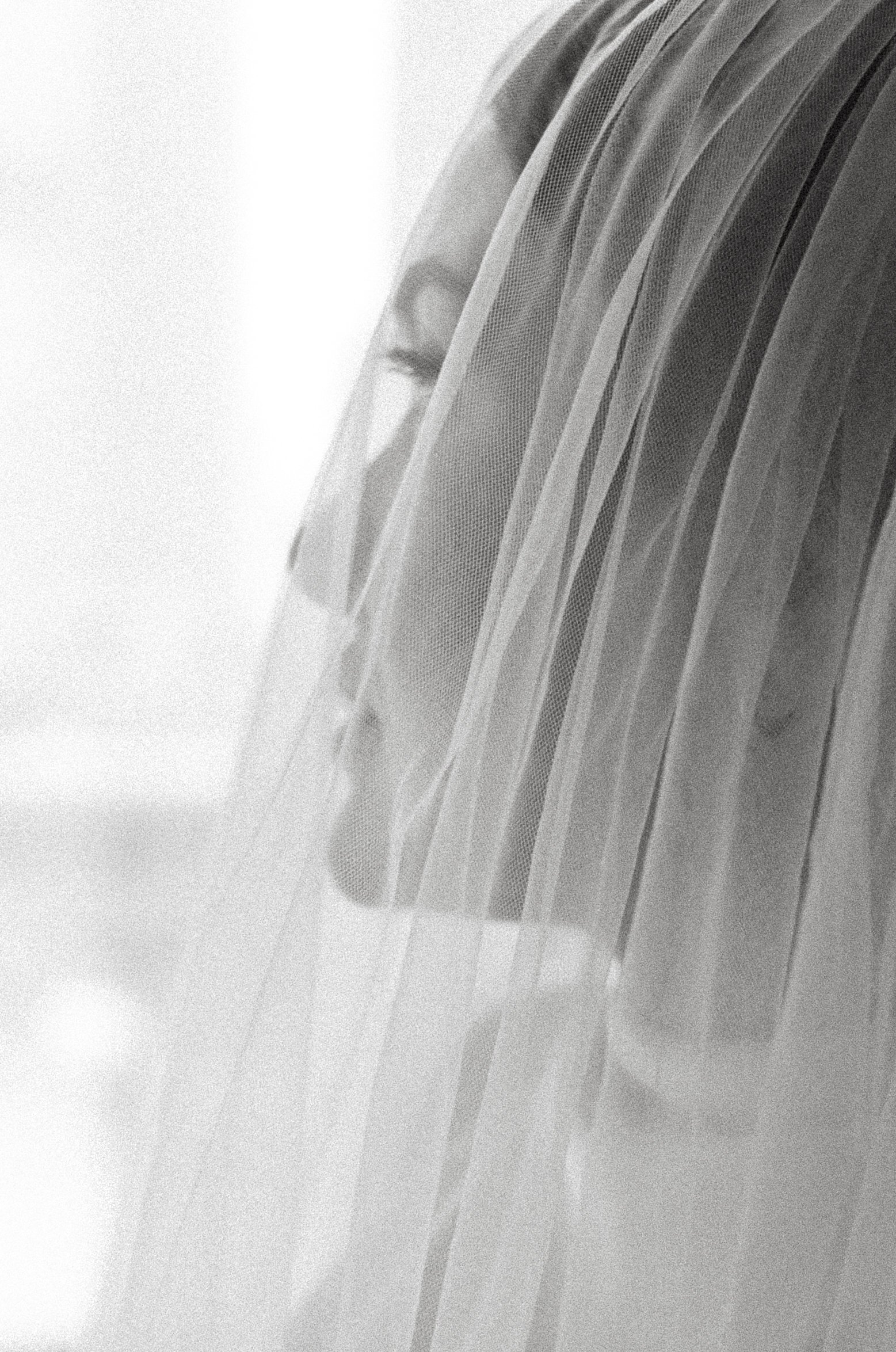 Black and white bridal portrait showcasing timeless elegance and flawless wedding makeup.