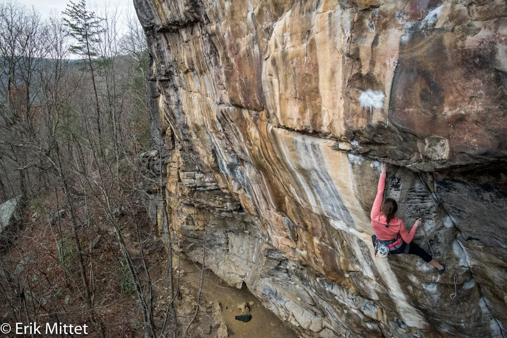 The author clipping a draw on Proper Soul after finishing the 2-bolt dihedral crux. Photo by Erik Mittet.