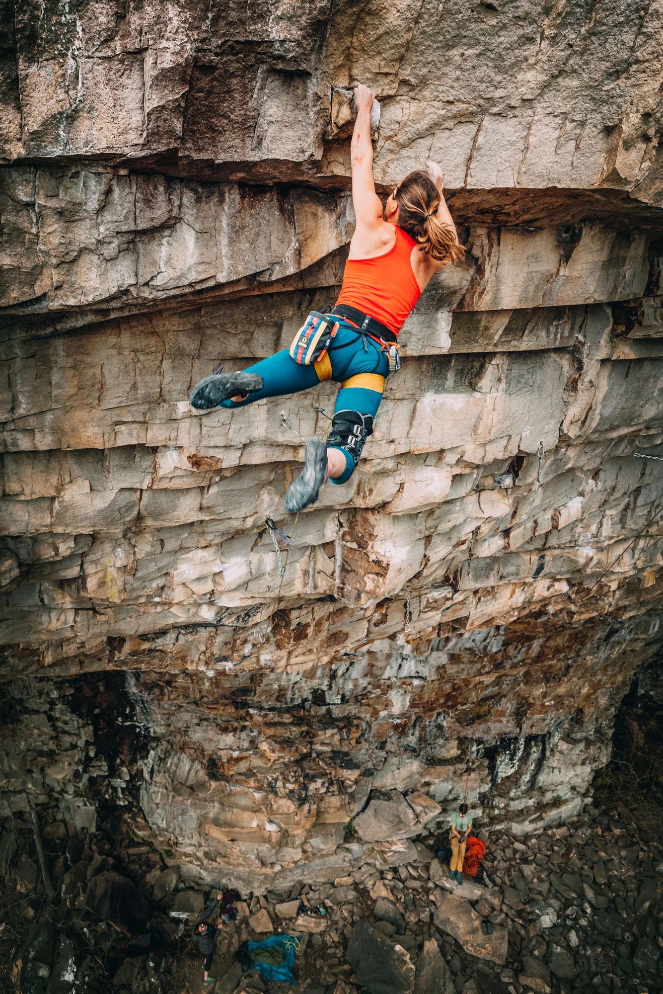 Laurel Graefe sticking the big move on Rockstar (5.13b) at Shaman Cave. Photo courtesy of Nathalie DuPre .