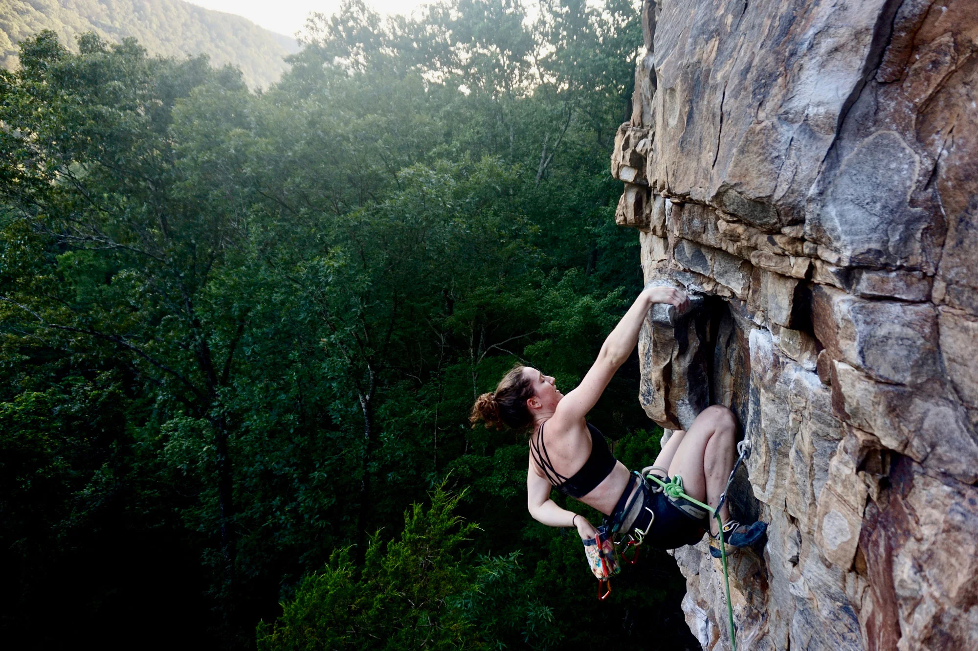 The author resting on one of many knee bars at the crag. Photo courtesy of Sarah Anne Perry .