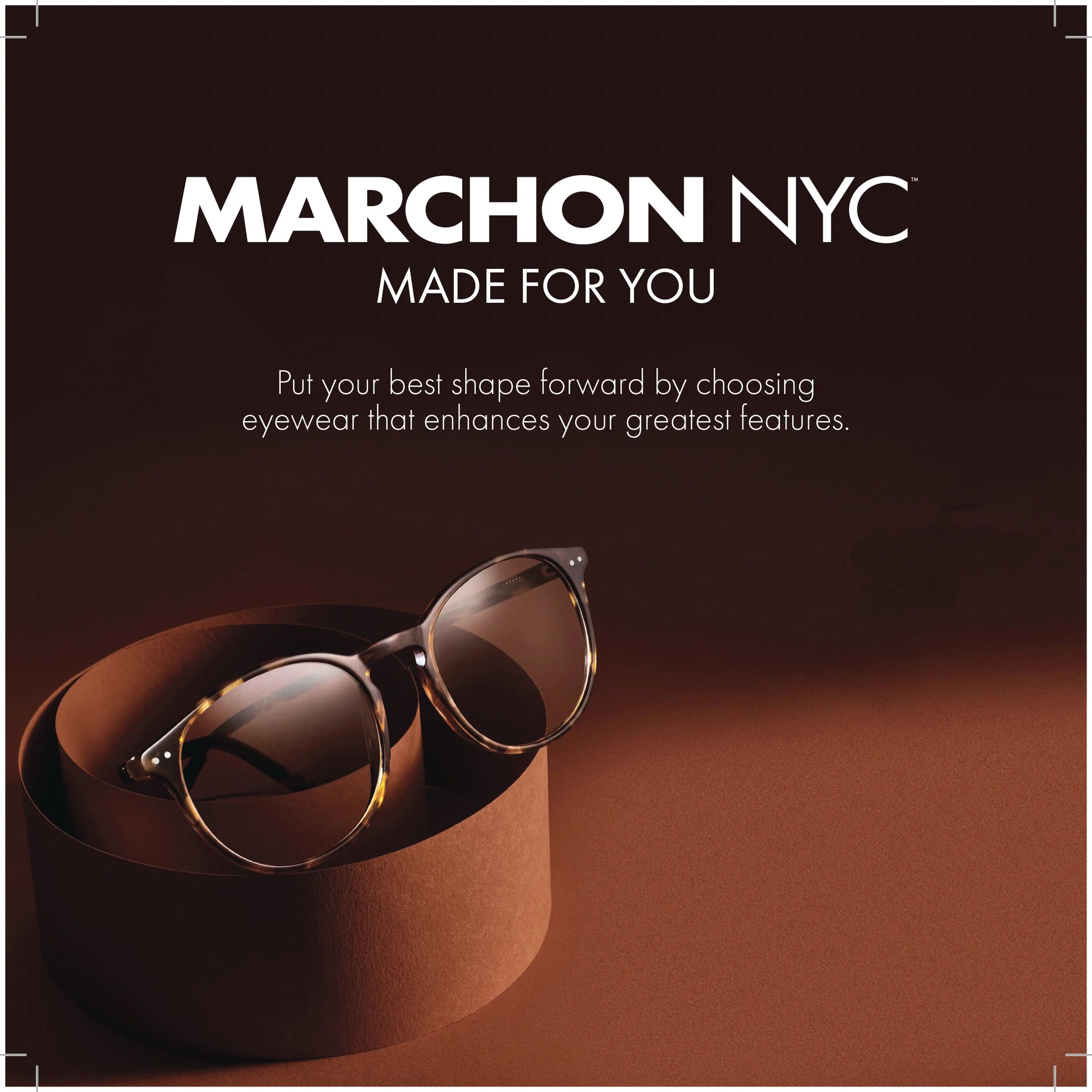 A pair of sunglasses resting on a cylindrical surface with a background gradient from dark to warm tones, accompanying promotional text for MARCHON NYC eyewear.