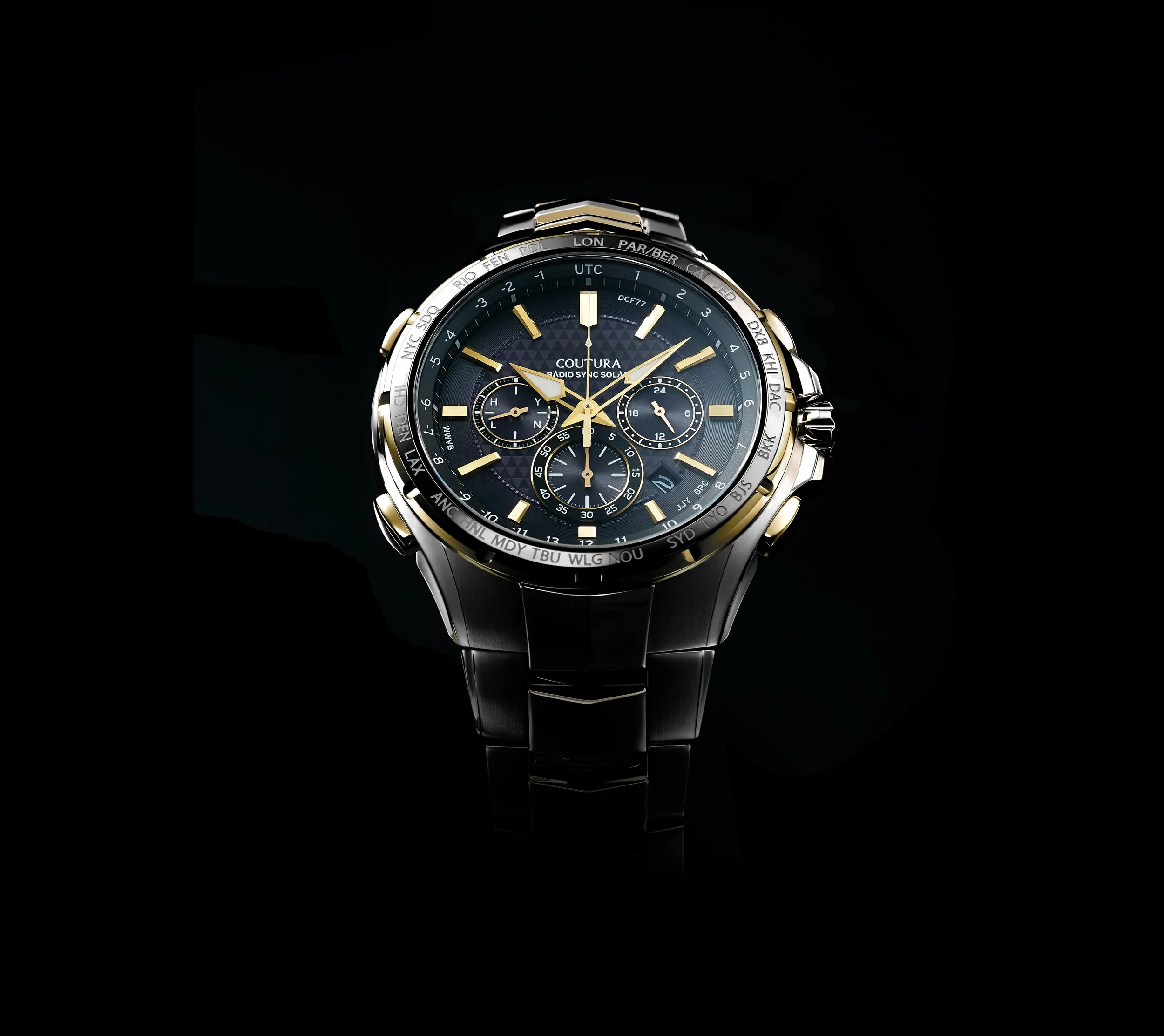 luxury men's wristwatch with black and gold design, multiple subdials, world time bezel, and black metal band on black background