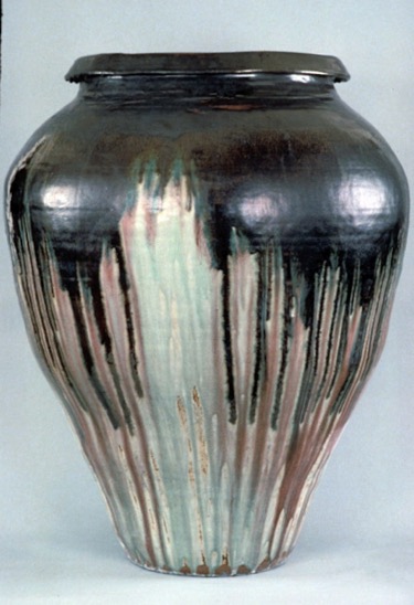colossal jar in black and green