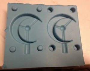 One part of a silicone mold used to form urethane parts.