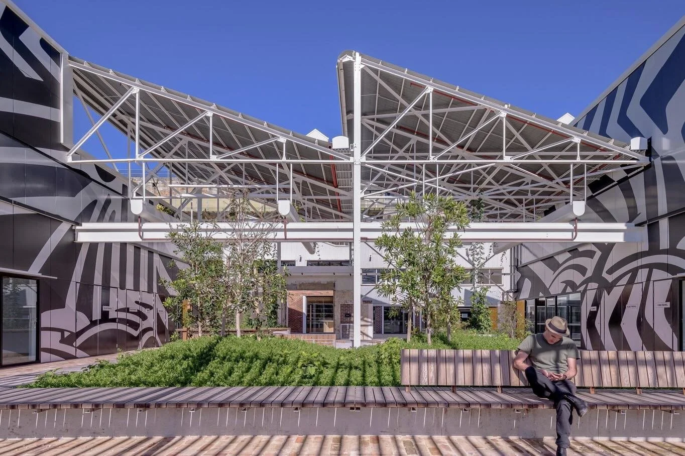 Located on Cammeraygal Land, Sub Base Platypus&rsquo;s Razzle Dazzle artwork links the site back to its history as a former submarine base through a direct reference to wartime naval camouflage.

Applied to the new fa&ccedil;ade walls defining the co