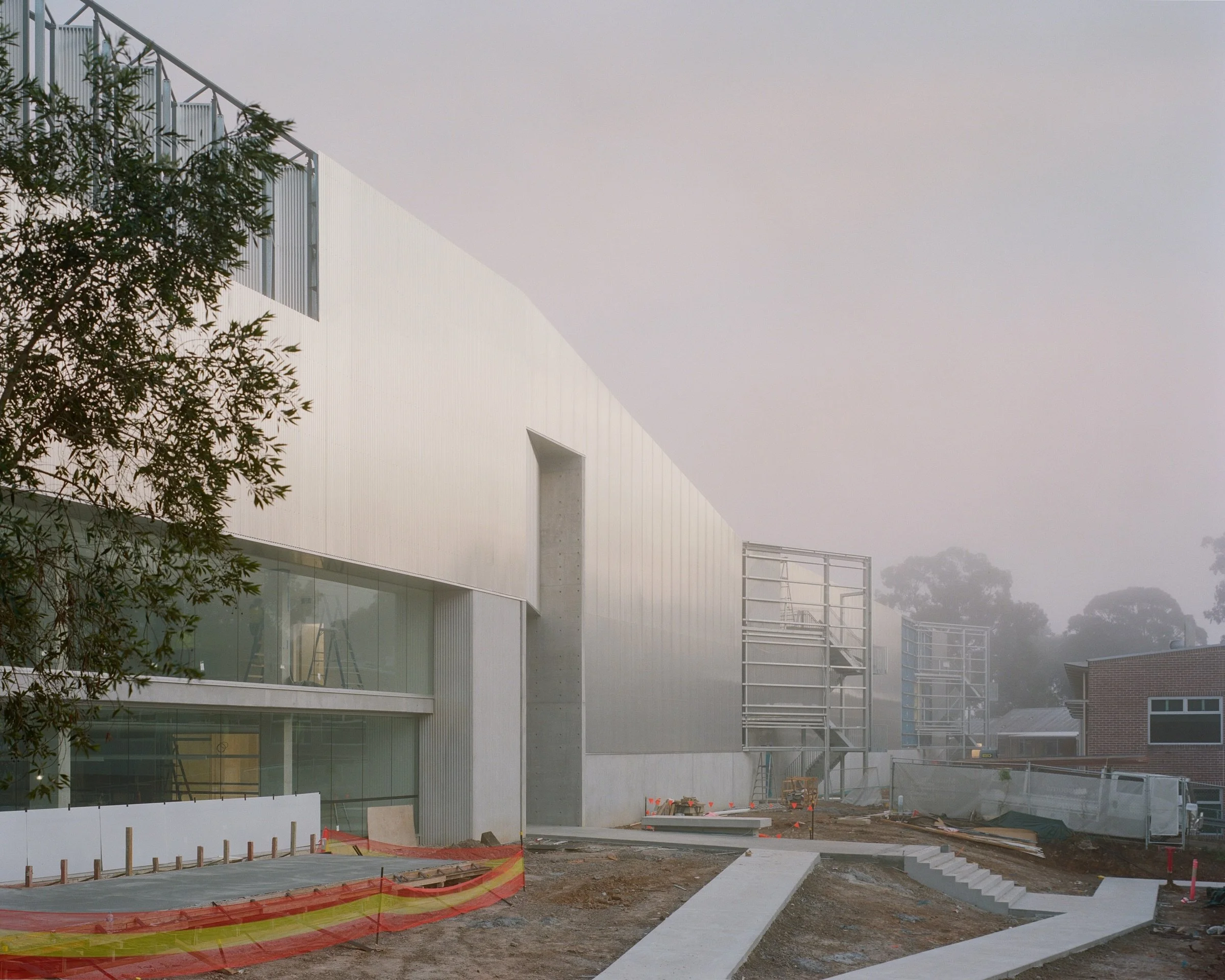 in the making.

The Powerhouse Castle Hill begins with a single, considered move: a simplified box, lifted.

Shifting the volume upward reveals the exhibition interior through glazing at key thresholds, creating a visual connection to the surrounding