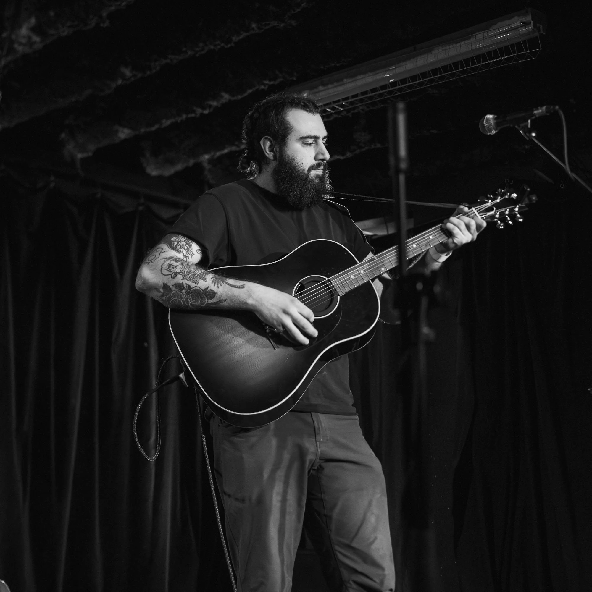 Isaac Baronikian’s “Jump” Coins ‘Recession Rock’ with Grit, Grace, and a Refusal to Fall