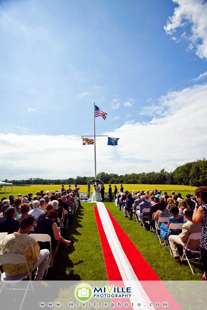 The ceremony - overlooking the rolling hills. Such a view! They got a red aisle runner from the rental company and then the ushers laid down the white runner just for the bride.
