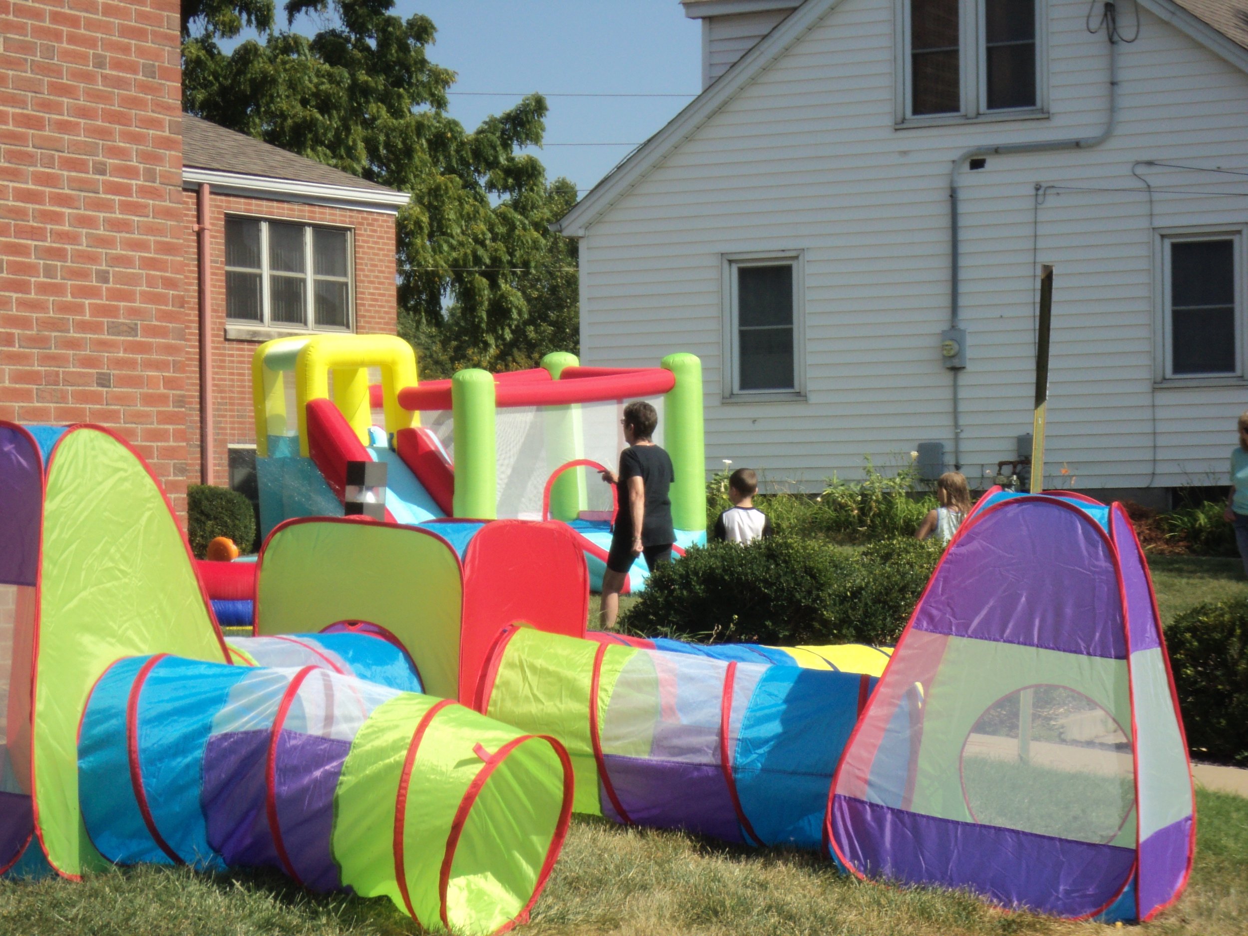 Bounce Houses - Mary Martin checking them out.JPG