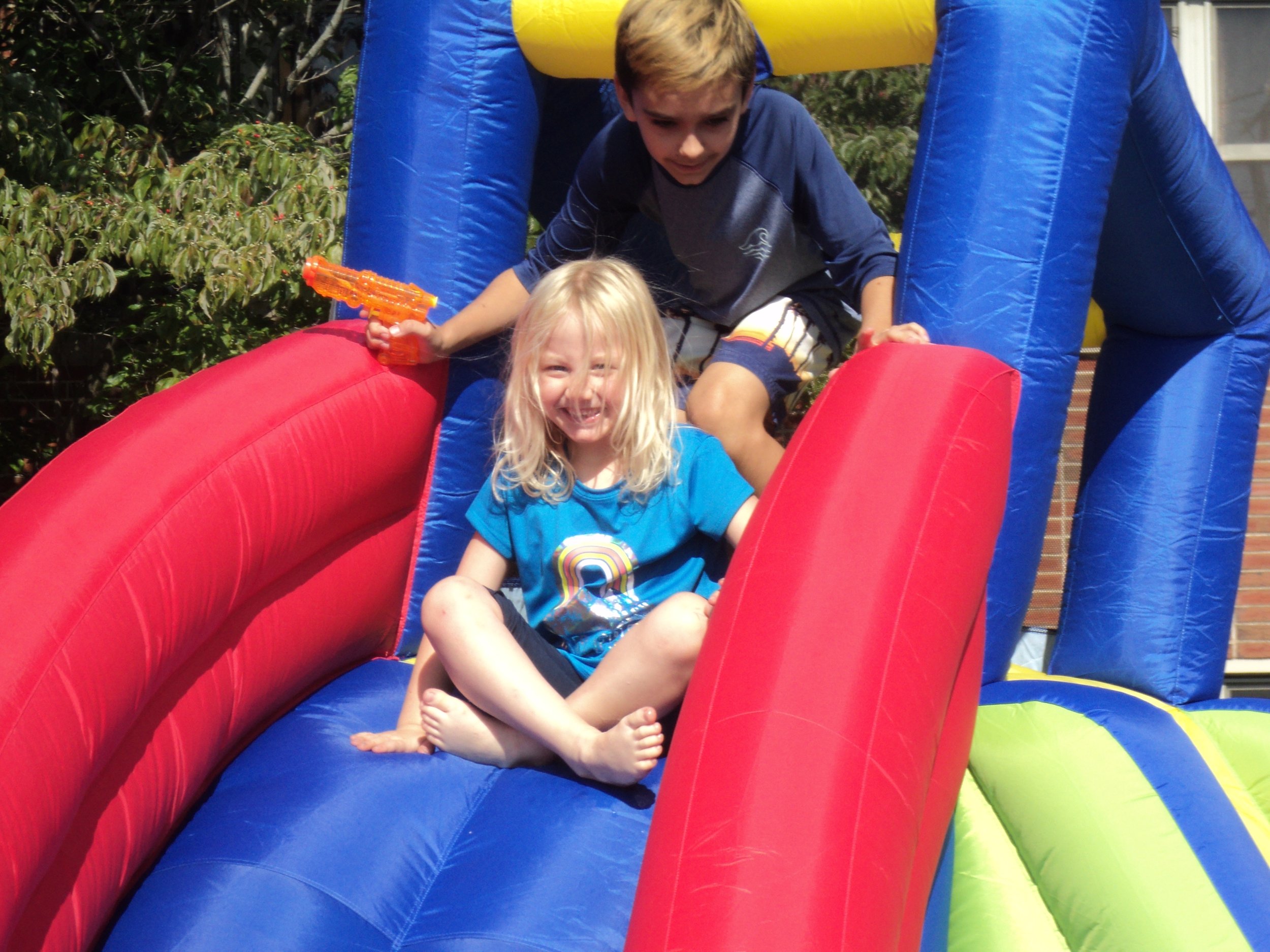 Rally Day 9-10-23 on the Bounce House Slide.JPG