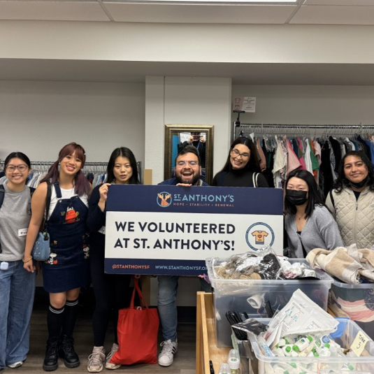 A group photo of AHEC Scholars volunteering at St. Anthony's Foundation. Click the photo to download the SF AHEC Scholars Brochure.