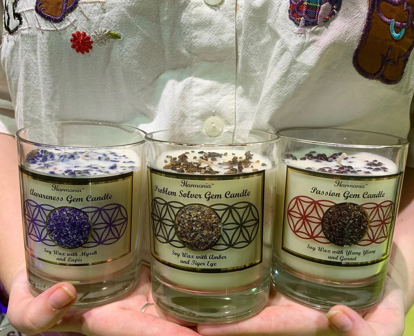 THESE CRYSTAL CHIP CANDLES HOLD THEIR OWN UNIQUE ENERGIES WAITING TO BE RELEASED WHILE BURNING. TIGERS EYE, EMERALD, LAPIS LAZULI &amp; GARNET ARE ALL AVAILABLE.