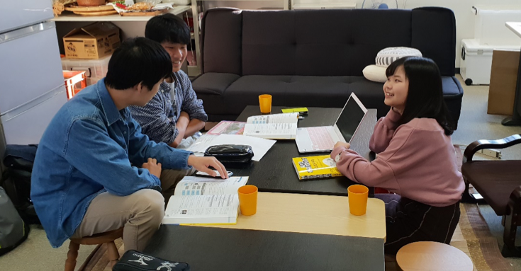 Students discuss methods to extract precious metals from electronics waste for 2020 Olympic medals.
