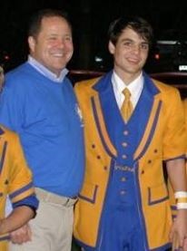 Decades later he marched again with #4 son, Nick. Mark was OK on the sax. Nick was very good on the quad-toms. Pictured are father and son performing together at SPS 100 Year Anniversary Halftime.