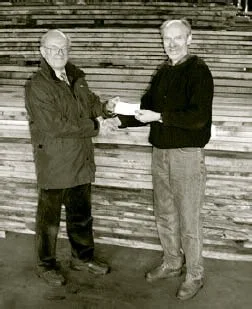 Harry hands over another cheque to Woodland Heritage co-founder, Peter Goodwin.