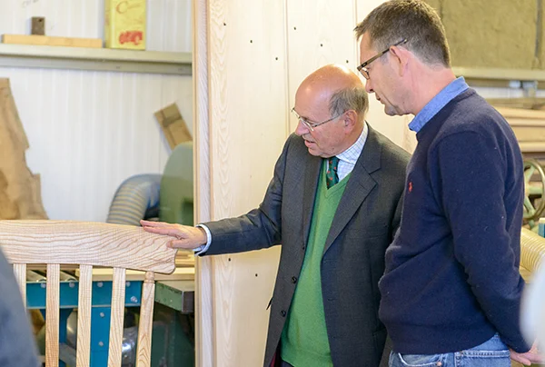 Lord Gardiner admiring ripple ash rocking chair with Ben Sutton