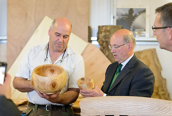 Lord Gardiner enjoying Nick Shore's treen