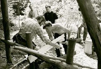 Mike Abbott (left) helps Steve split a green oak billet.