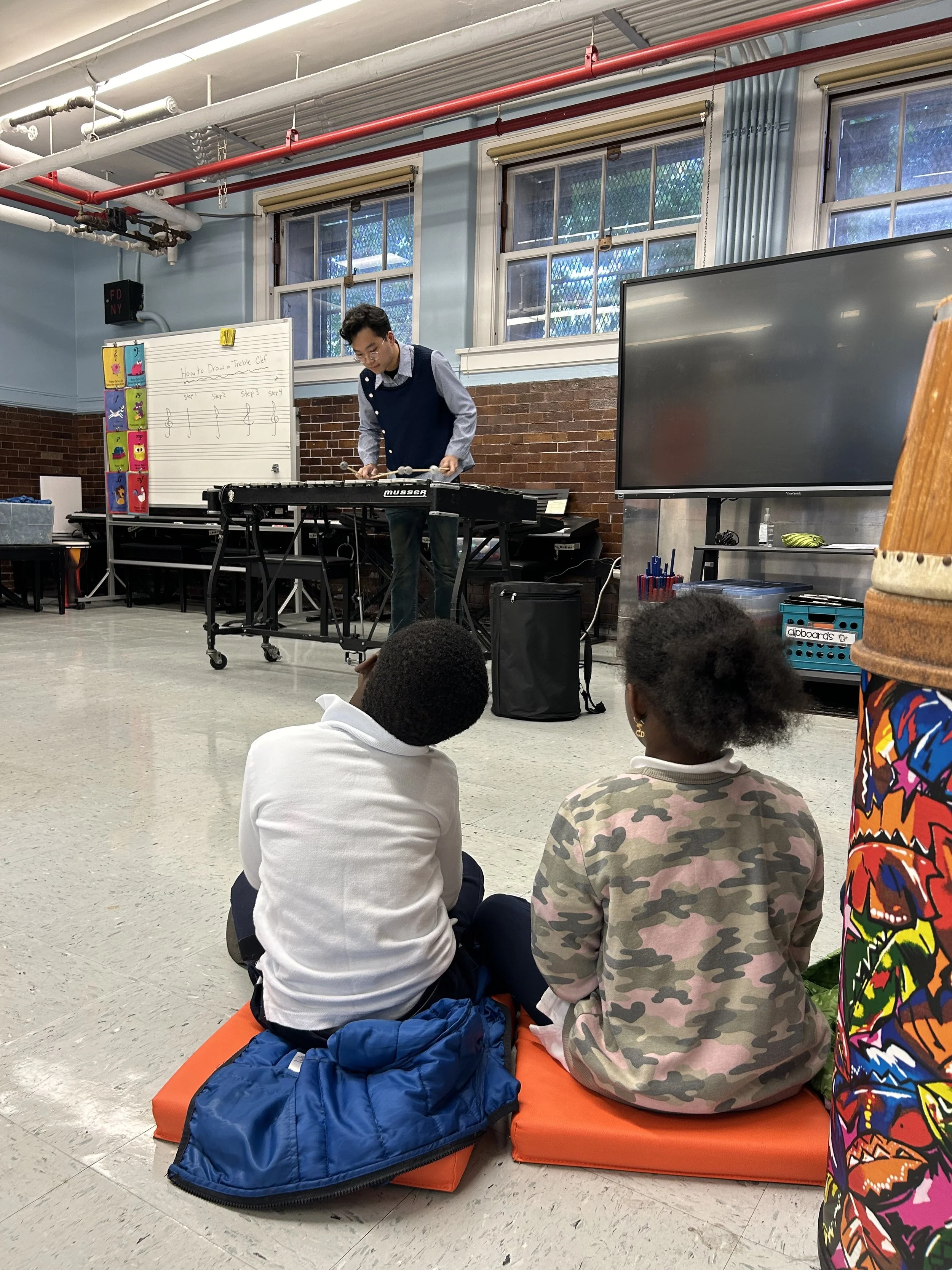 YCA School Visit - Michael Yeung PCISP man with littles.jpg