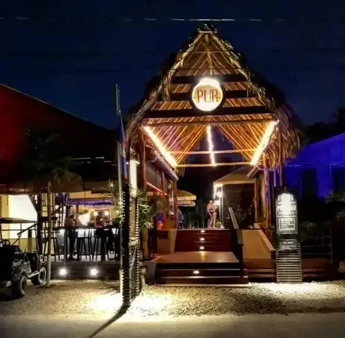 pur-boutique-cabanas-entrance-night-view-ambergris-caye-belize-resort.webp
