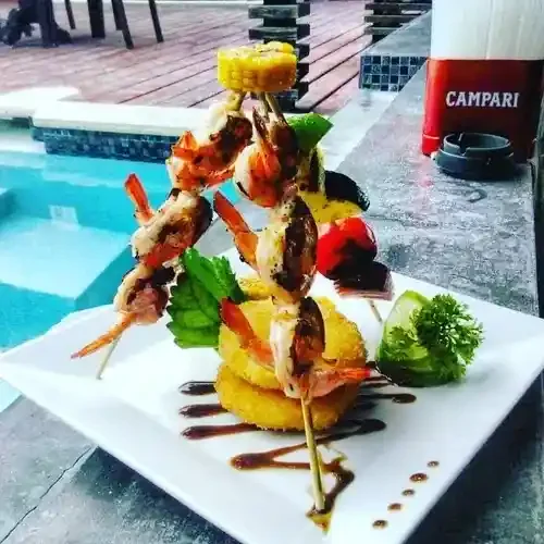 pur-boutique-cabanas-grilled-seafood-skewers-ambergris-caye-belize-dining.webp