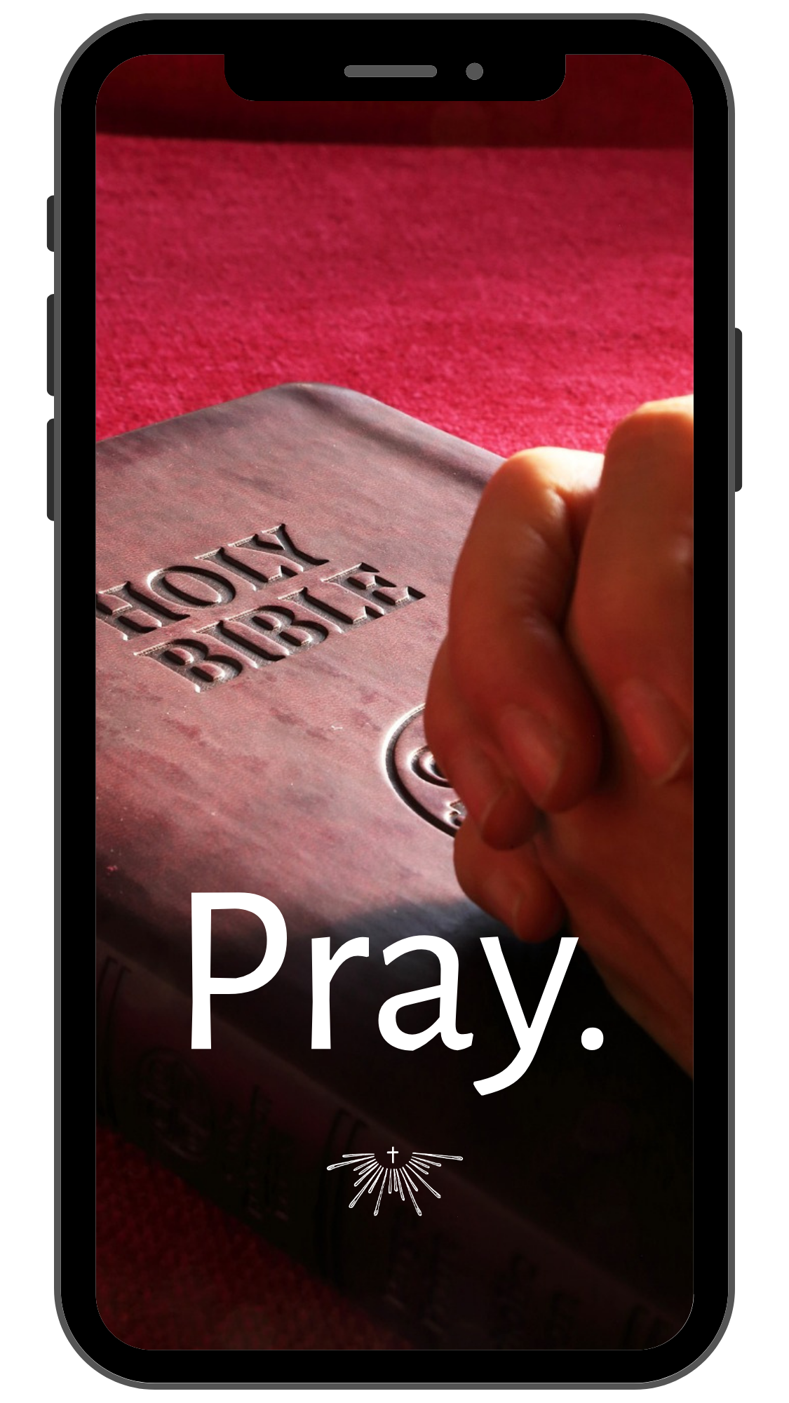 A person’s hand holding a smartphone displaying an image of a Bible with the word "Pray" written on it. The background is red.