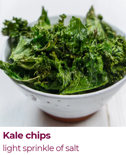 A bowl of kale chips with a light sprinkle of salt