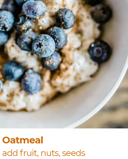 Close-up of oatmeal topped with blueberries and sprinkled with nuts and seeds