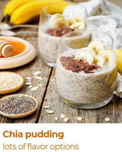 Two glasses of chia pudding topped with banana slices and chocolate shavings, with bananas, a spoon, and bowls of chia seeds and oats on a wooden surface.