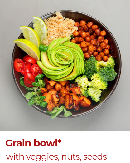 A grain bowl with quinoa, chickpeas, broccoli, roasted sweet potatoes, cherry tomatoes, avocado slices, lime wedges, and green herbs