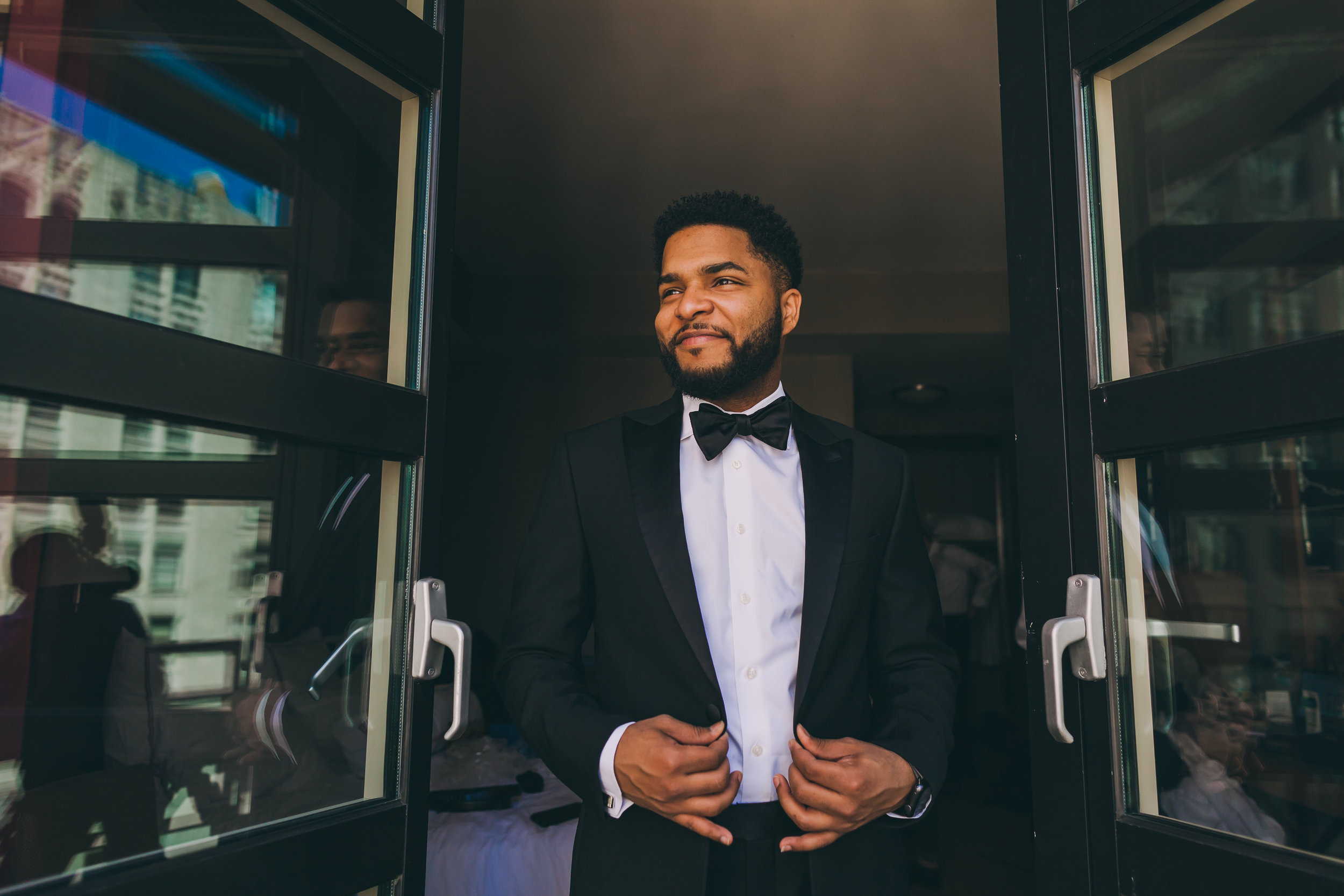 Epic portrait of the groom getting ready before his wedding at the Giraffe Hotel in Manhattan, New York