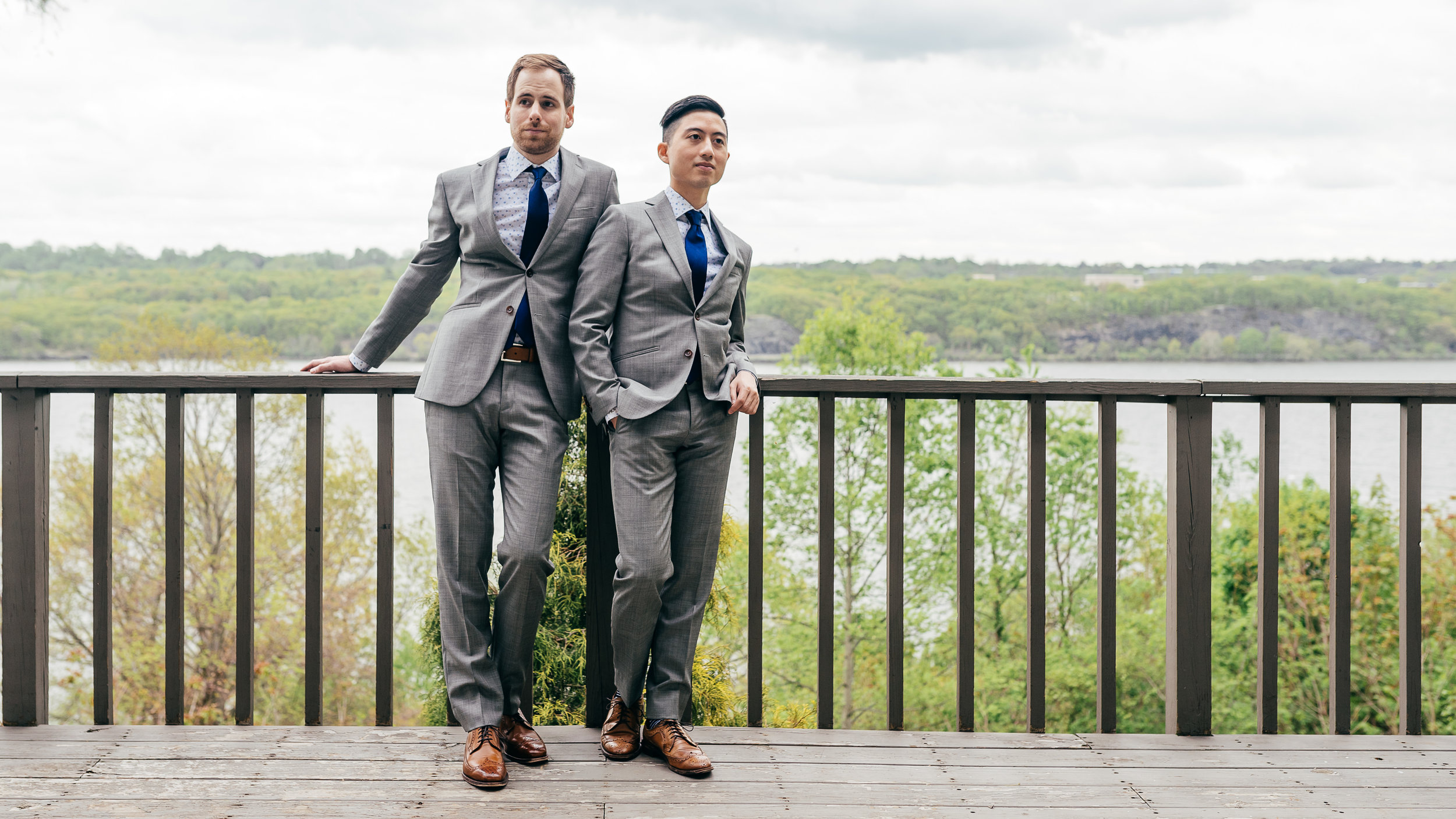 Gay wedding portrait taken at the Buttermilk Falls in Hotel in the Hudson River Valley, New York