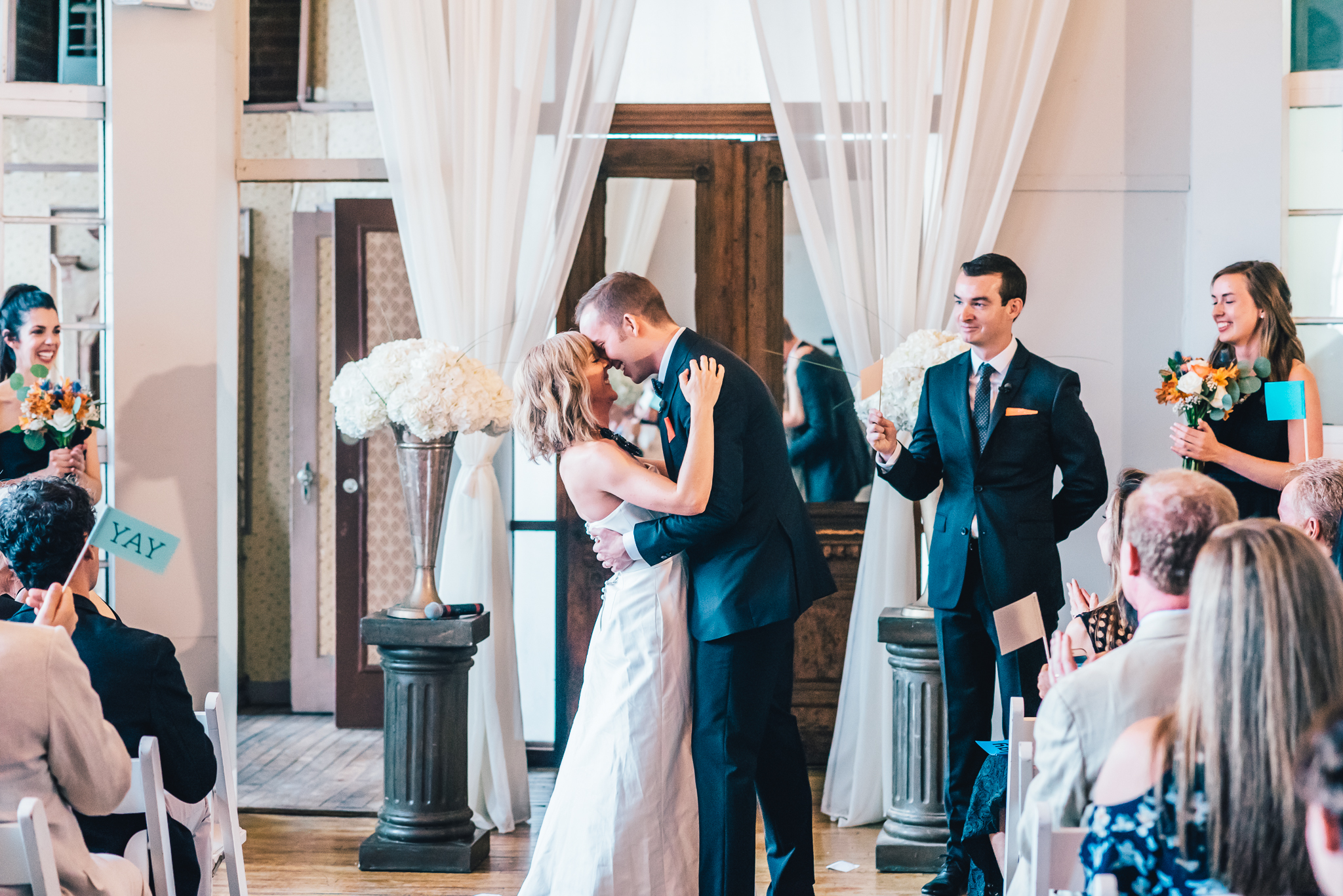 First kiss between a bride and groom at their wedding in the Metropolitan Building in Brooklyn, New York