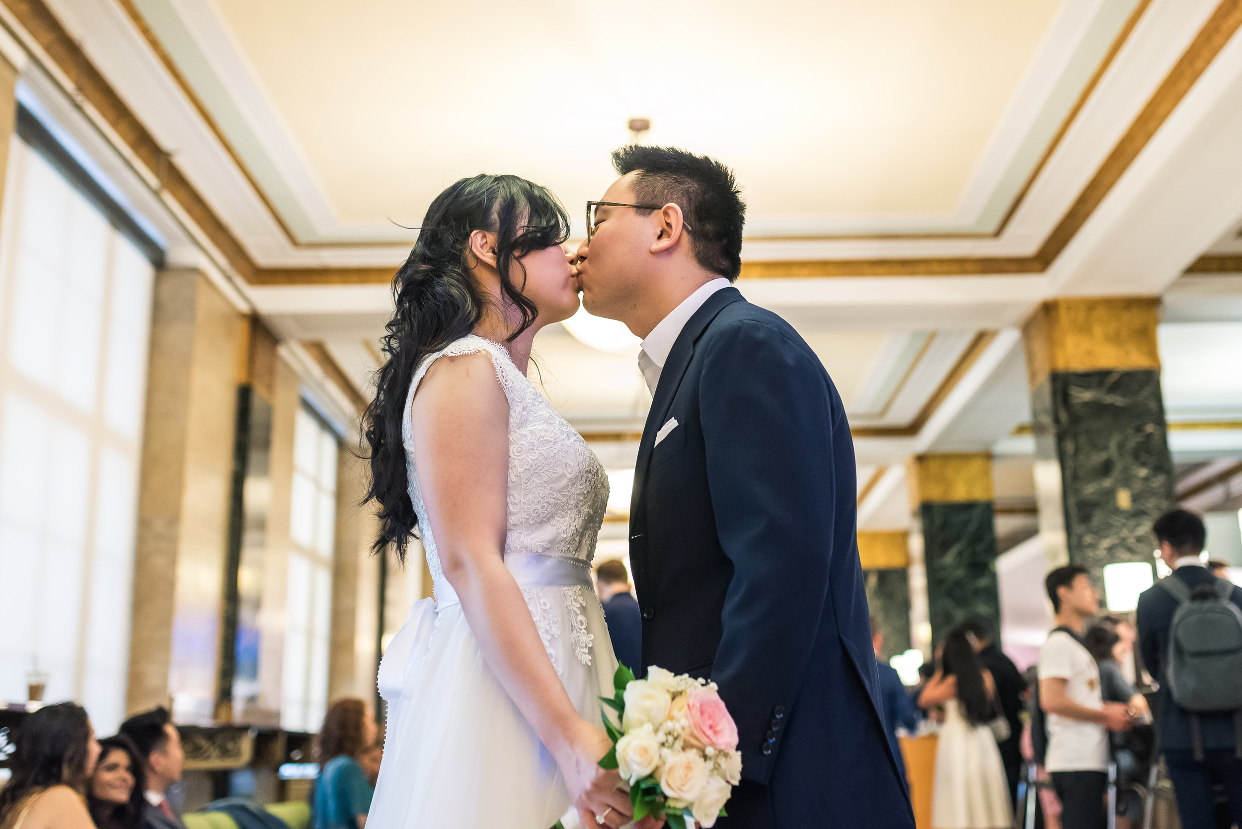 many and andy had a low key ceremony at city hall in manhattan, new york. Part of being a photojournalistic photographer is being able to set up natural looking photos that tell the story of their day. after the ceremony, we took some photos in the area as well as on the Brookyln Bridge
