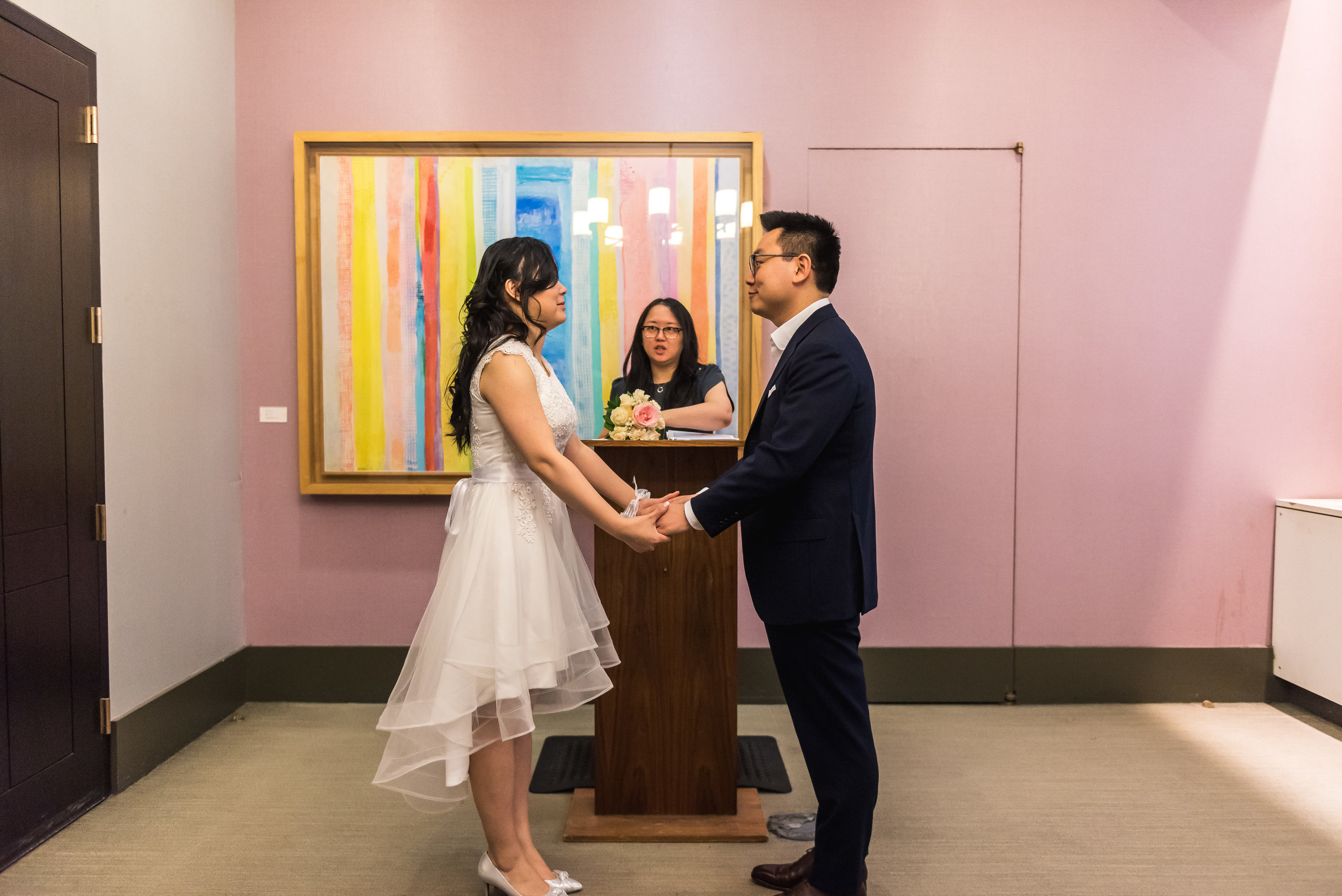 many and andy had a low key ceremony at city hall in manhattan, new york. Part of being a photojournalistic photographer is being able to set up natural looking photos that tell the story of their day. after the ceremony, we took some photos in the area as well as on the Brookyln Bridge