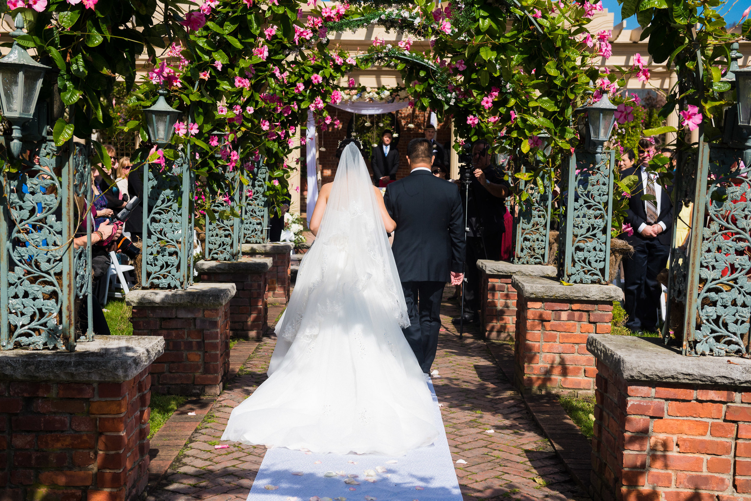 another view of ping as she walks down the aisle to her fiance brent, at her wedding at the manor in west orange, new jersey