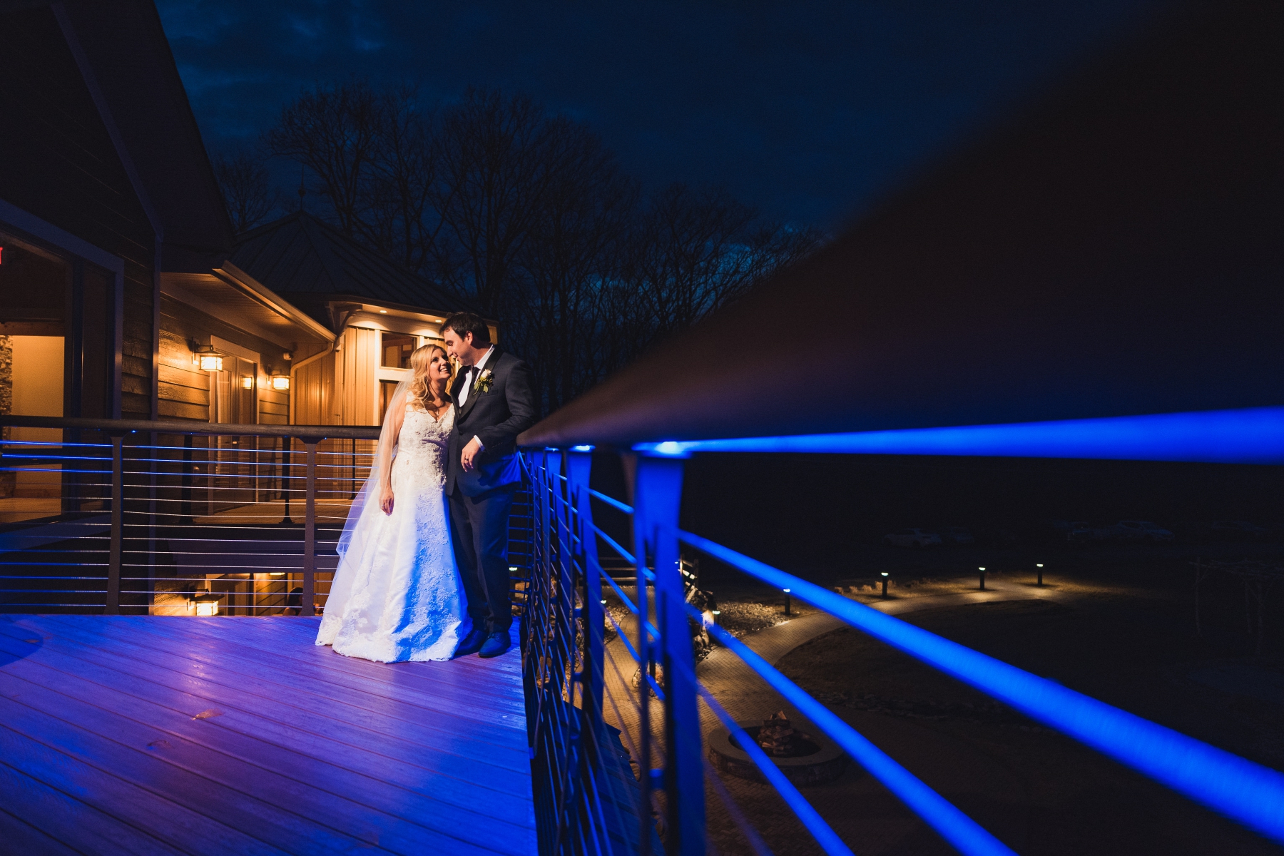  Nearing the end of the night, i wanted to do one more night portrait of the two of them. Rock Island Lake Club has this really cool blue uplighting that they use on the patio, so i took them outside, incorporated them as leading lines into my image 