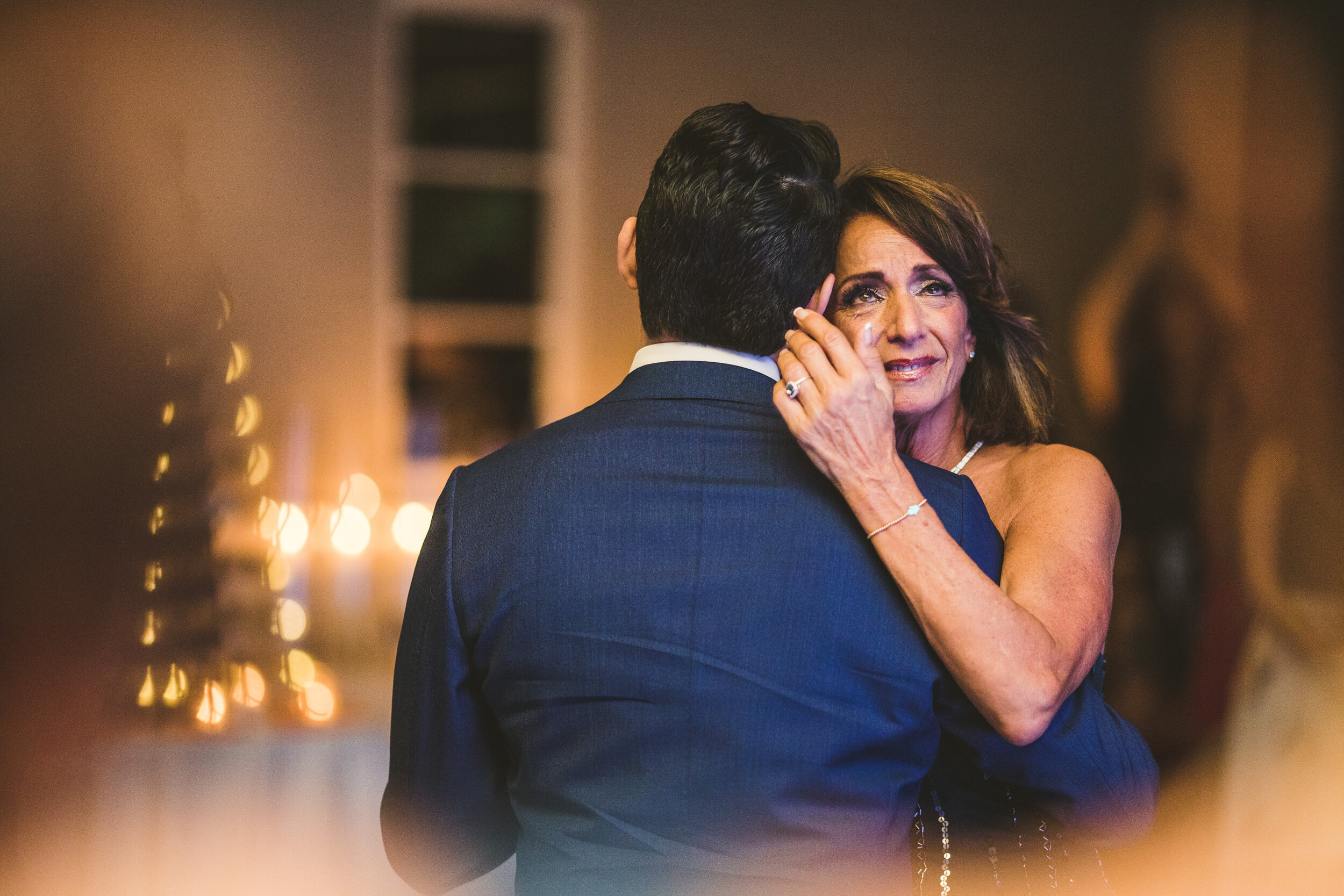 Groom's mother crying during their first dance at the Loeb Boathouse in Central Park,. New York.