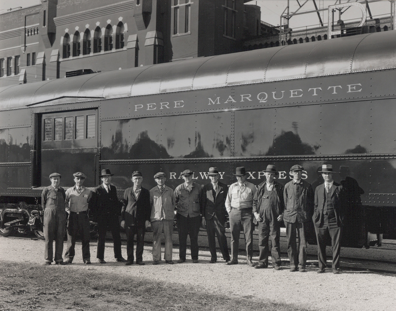  This photo is believed to be taken right after an inspection of a rail car ordered by the Pere Marquette rail line. &nbsp;The men pictured were likely foremen involved in its production. &nbsp;The man on the right is believed to be a representative 