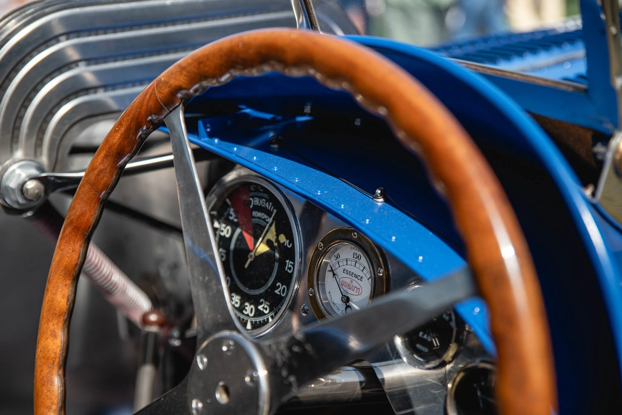 Close up image of gauges in an old Bugatti.