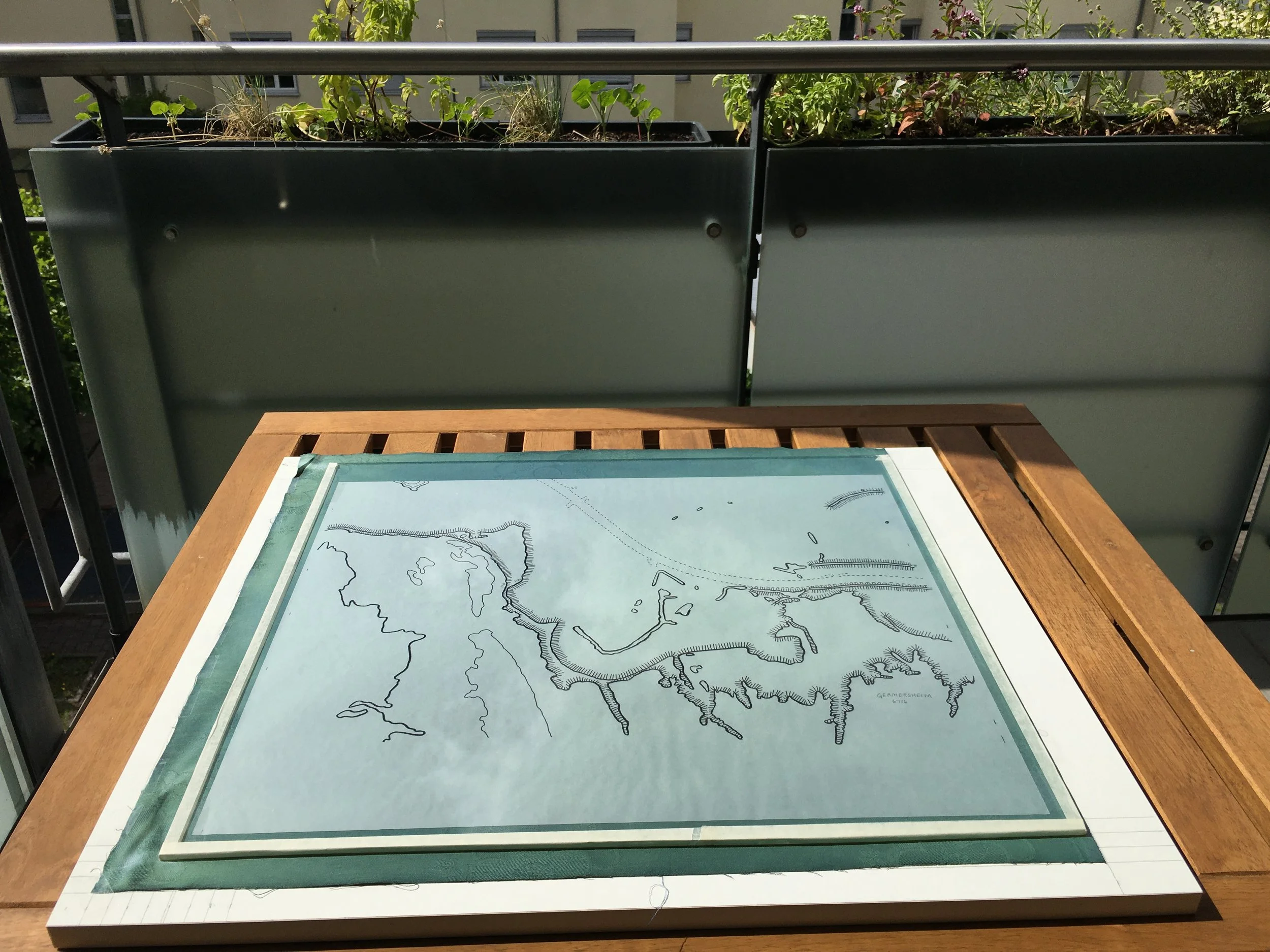 A cyanotype panel being exposed to sunlight on the balcony.