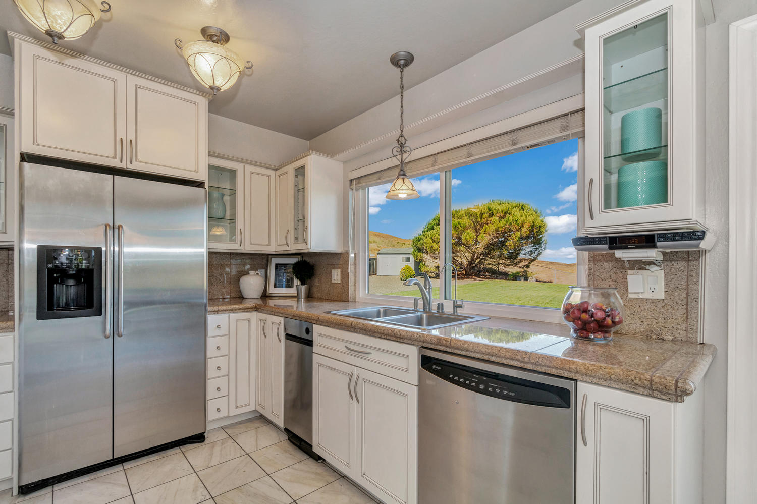 The remodeled kitchen offers ample storage & stunning views!