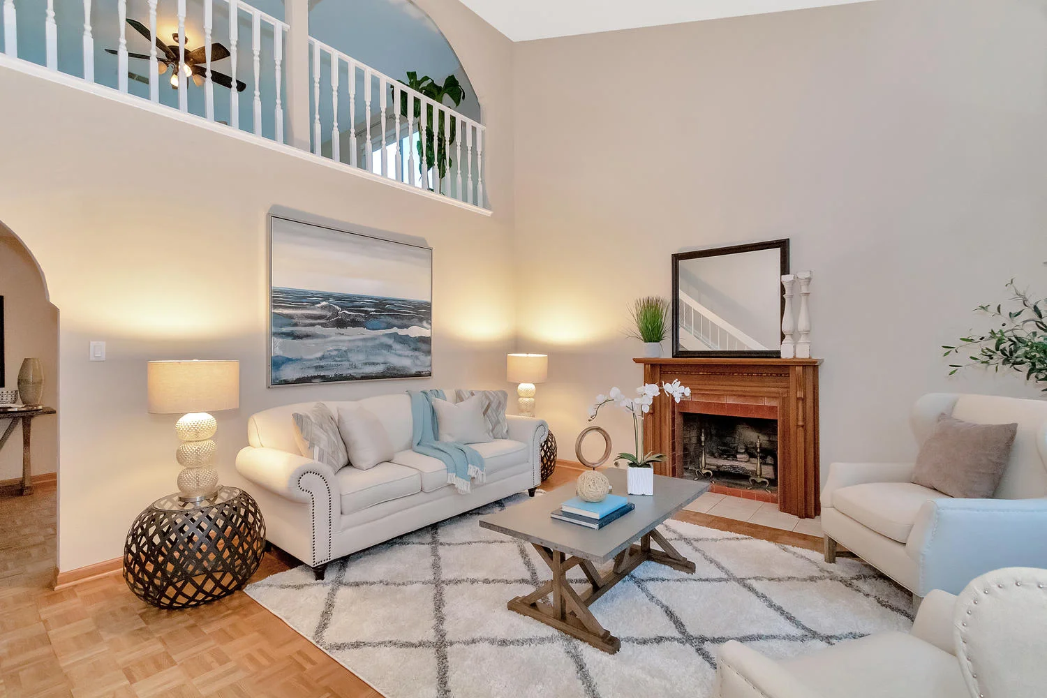 Spacious living room has vaulted ceilings and opens to upstairs family room.