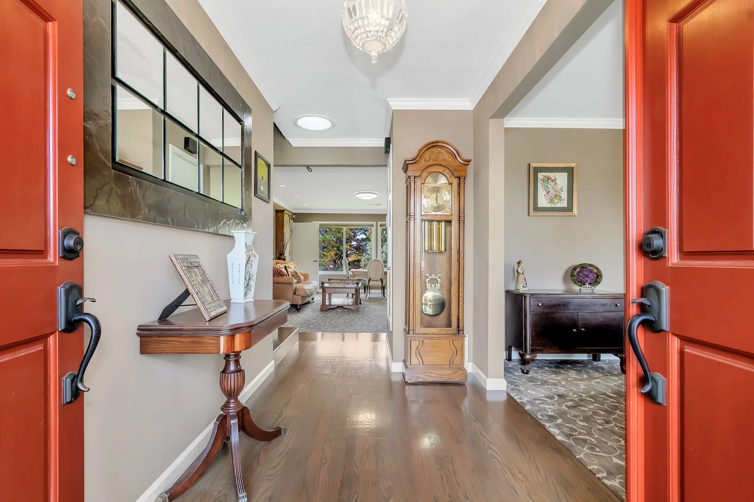 Double doors open to beautiful genuine oak floors and inlaid woven carpet.