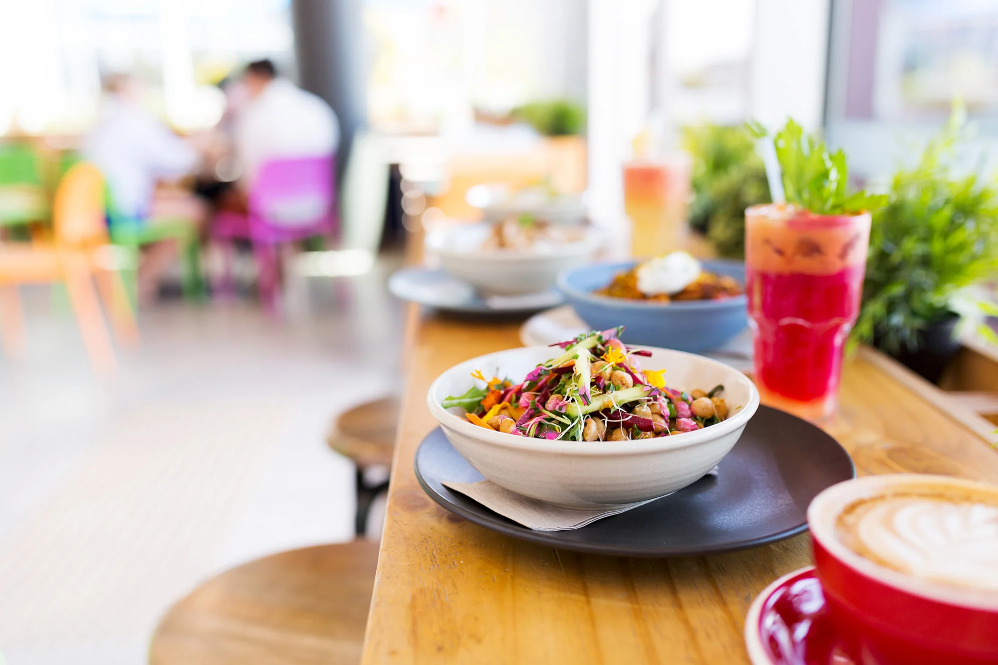 Imagery taken for Raw Energy in 2017 by Daniel Hine, Sunshine Coast food photographer. Dishes include acai bowls, pitaya bowls, juices, smoothies, pancakes, smashed avocado, vege fritters and coffee. Fresh and healthy